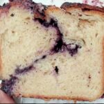 slice of bread cross section showing berry & cheese spiral filling