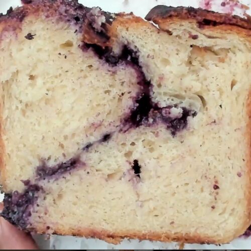 slice of bread cross section showing berry & cheese spiral filling